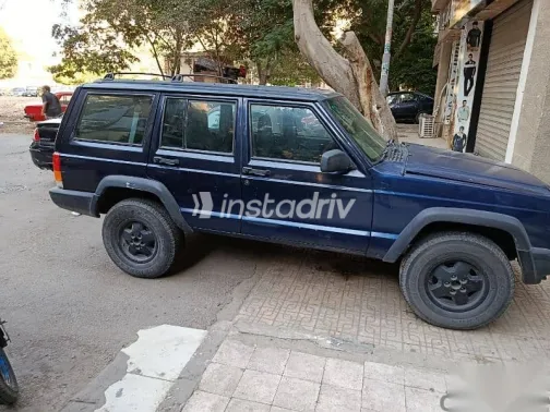 جيب شيروكي 1999 أزرق غامق مستعملة للبيع - 2