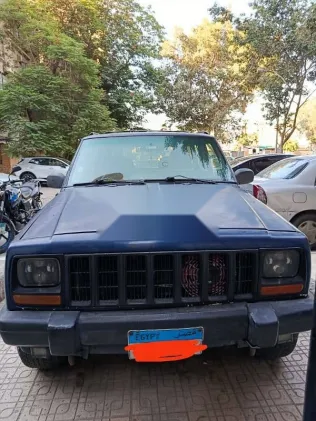 جيب شيروكي 1999 أزرق غامق مستعملة للبيع