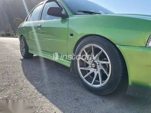 ميتسوبيشي لانسر 1999 أخضر مستعملة للبيع - 1