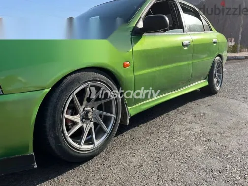 ميتسوبيشي لانسر 1999 أخضر مستعملة للبيع - 5