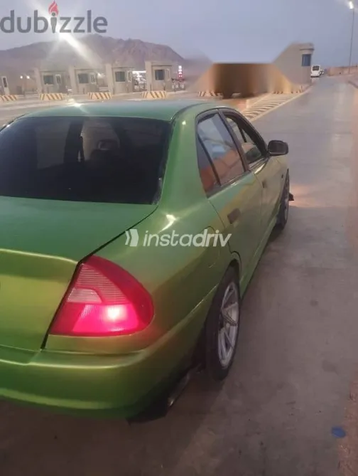 ميتسوبيشي لانسر 1999 أخضر مستعملة للبيع - 9