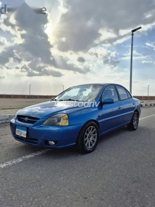 كيا ريو 2005 أزرق غامق مستعملة للبيع - 4