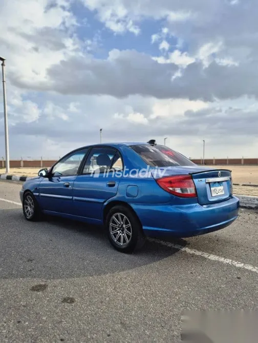 كيا ريو 2005 أزرق غامق مستعملة للبيع - 5