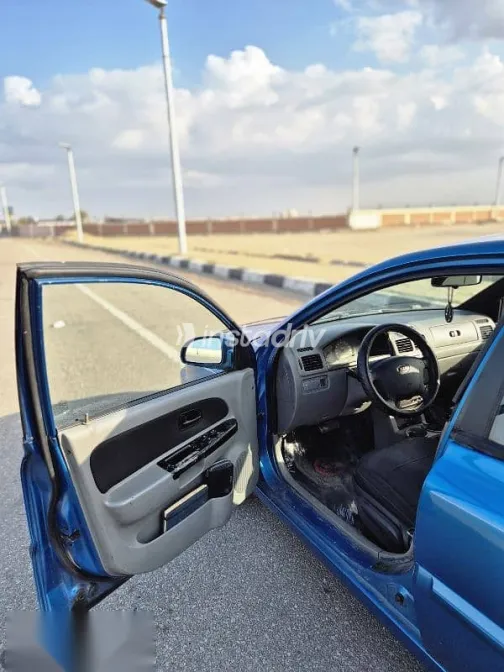 كيا ريو 2005 أزرق غامق مستعملة للبيع - 7