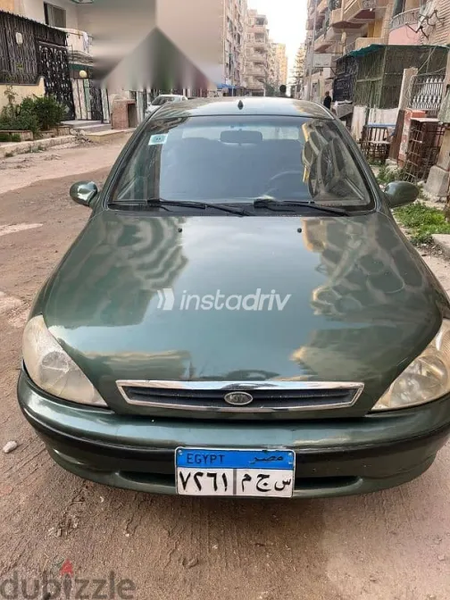 كيا ريو 2001 أخضر مستعملة للبيع - 1