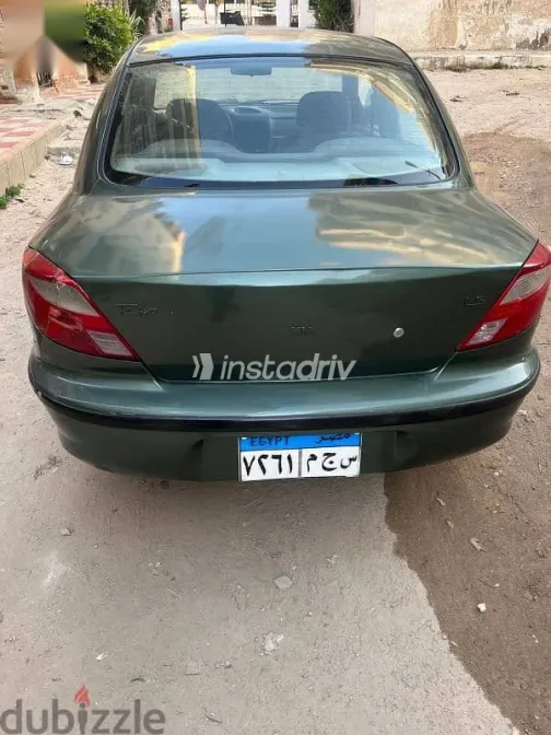 كيا ريو 2001 أخضر مستعملة للبيع - 3