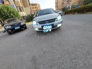 ميتسوبيشي لانسر 2007 ذهبي مستعملة للبيع