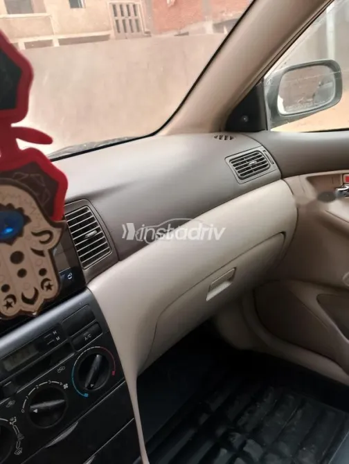 تويوتا كورولا 2003 أبيض مستعملة للبيع - 1