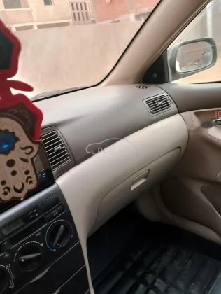 تويوتا كورولا 2003 أبيض مستعملة للبيع