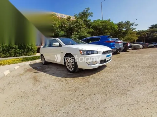 ميتسوبيشي لانسر 2015 أبيض مستعملة للبيع - 4