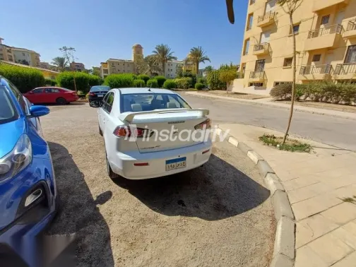 ميتسوبيشي لانسر 2015 أبيض مستعملة للبيع - 7