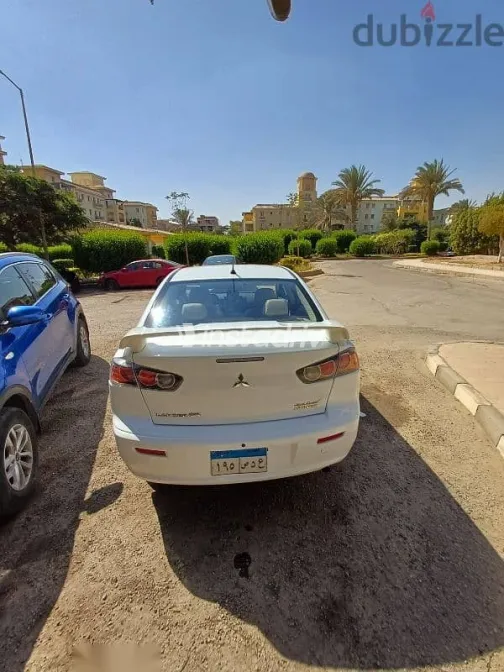 ميتسوبيشي لانسر 2015 أبيض مستعملة للبيع - 9