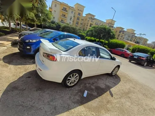 ميتسوبيشي لانسر 2015 أبيض مستعملة للبيع - 10