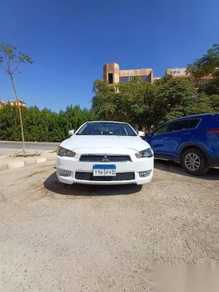 ميتسوبيشي لانسر 2015 أبيض مستعملة للبيع