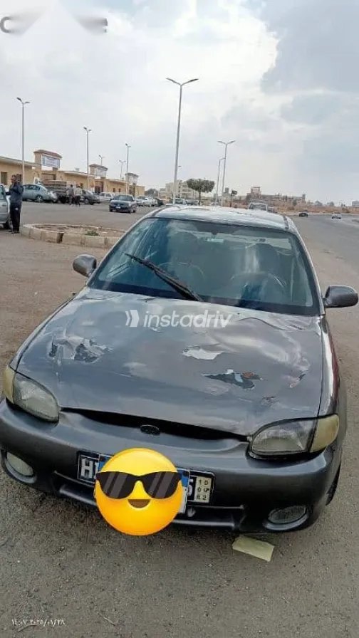 هيونداي اكسنت 1999 بني مستعملة للبيع - 1