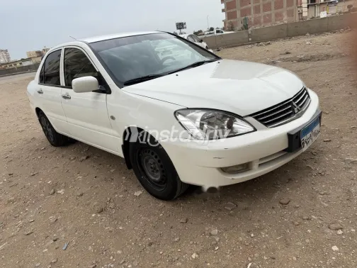 ميتسوبيشي لانسر بومة 2014 أبيض مستعملة للبيع - 6