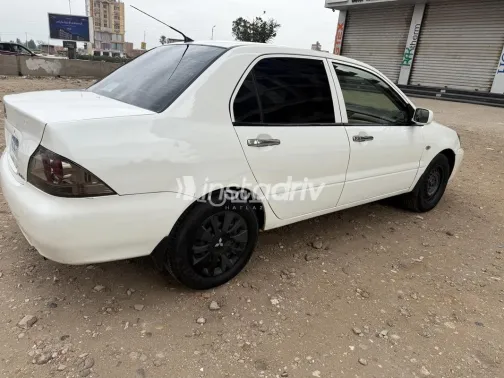 ميتسوبيشي لانسر بومة 2014 أبيض مستعملة للبيع - 7