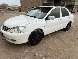 ميتسوبيشي لانسر بومة 2014 أبيض مستعملة للبيع