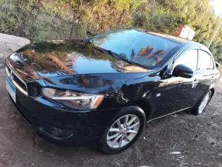 ميتسوبيشي لانسر اى اكس شارك 2015 أسود مستعملة للبيع