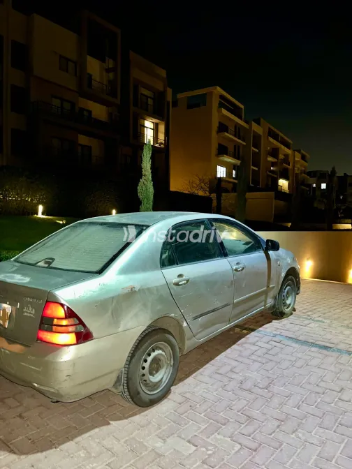 تويوتا كورولا 2004 أبيض مستعملة للبيع - 6