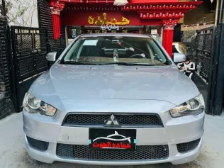 ميتسوبيشي لانسر 2015 فضي مستعملة للبيع