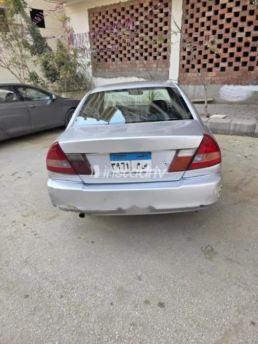 ميتسوبيشي لانسر 1999 فضي مستعملة للبيع - 4