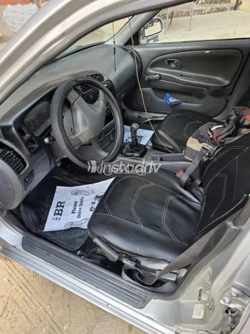 ميتسوبيشي لانسر 1999 فضي مستعملة للبيع - 5