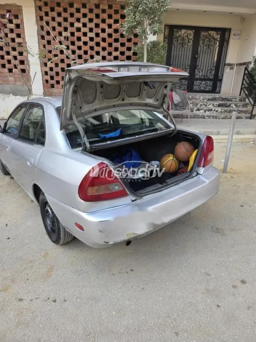 ميتسوبيشي لانسر 1999 فضي مستعملة للبيع - 6