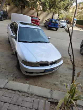 ميتسوبيشي لانسر 1999 فضي مستعملة للبيع