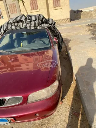 دايو نوبيرا 1 1997 أحمر غامق مستعملة للبيع