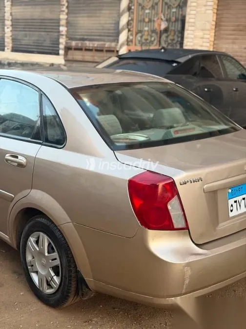 شيفروليه أوبترا 2009 ذهبي مستعملة للبيع - 5