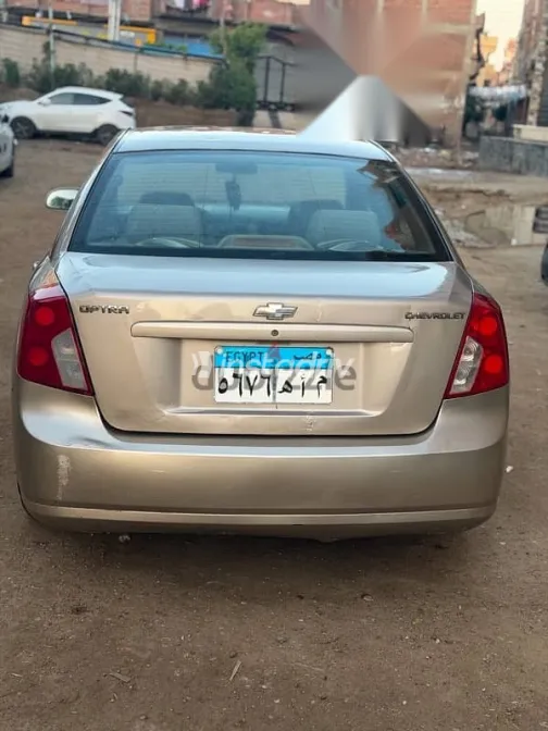 شيفروليه أوبترا 2009 ذهبي مستعملة للبيع - 6