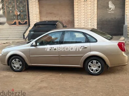 شيفروليه أوبترا 2009 ذهبي مستعملة للبيع - 9