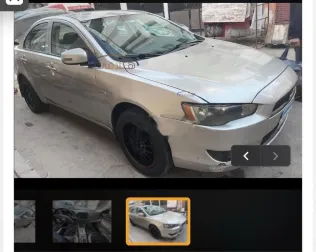 ميتسوبيشي لانسر اى اكس شارك 2015 فضي مستعملة للبيع