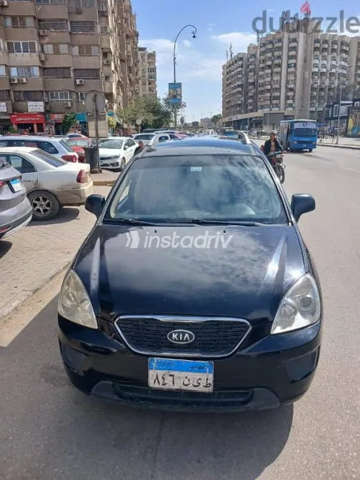 كيا كارينز 2012 أسود مستعملة للبيع - 1
