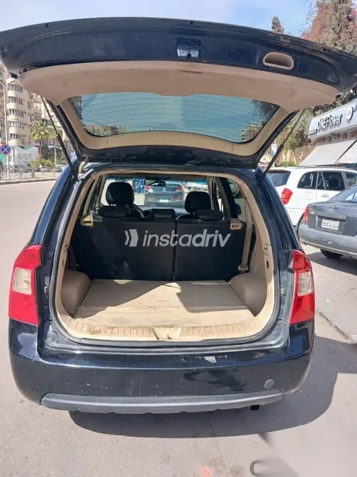 كيا كارينز 2012 أسود مستعملة للبيع - 7