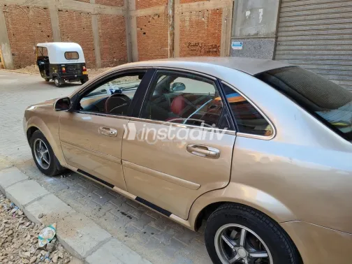 شيفروليه أوبترا 2009 ذهبي مستعملة للبيع - 5