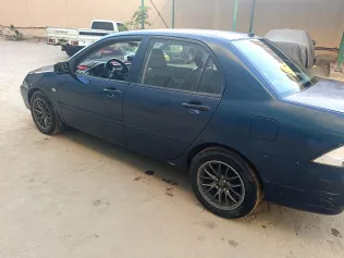 ميتسوبيشي لانسر 2008 أبيض مستعملة للبيع