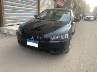 ميتسوبيشي لانسر اى اكس شارك 2014 أسود مستعملة للبيع