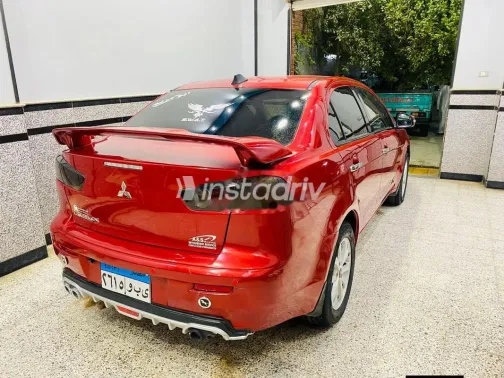 ميتسوبيشي لانسر اى اكس شارك 2015 أحمر مستعملة للبيع - 1