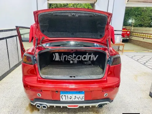 ميتسوبيشي لانسر اى اكس شارك 2015 أحمر مستعملة للبيع - 9