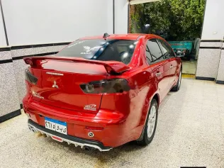 ميتسوبيشي لانسر اى اكس شارك 2015 أحمر مستعملة للبيع