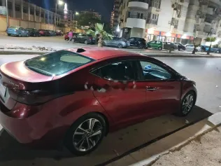 هيونداي إلنترا ام دى 2012 أحمر غامق مستعملة للبيع