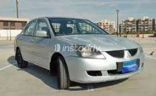 ميتسوبيشي لانسر بومة 2006 أبيض مستعملة للبيع - 1