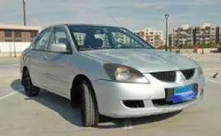 ميتسوبيشي لانسر بومة 2006 أبيض مستعملة للبيع