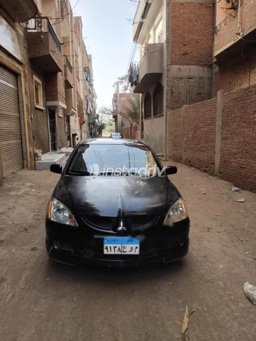 ميتسوبيشي لانسر بومة 2004 أسود مستعملة للبيع - 1