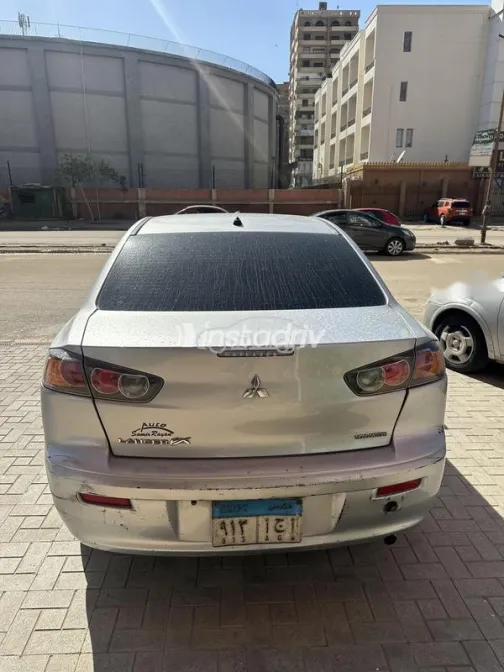 ميتسوبيشي لانسر 2015 فضي مستعملة للبيع - 4