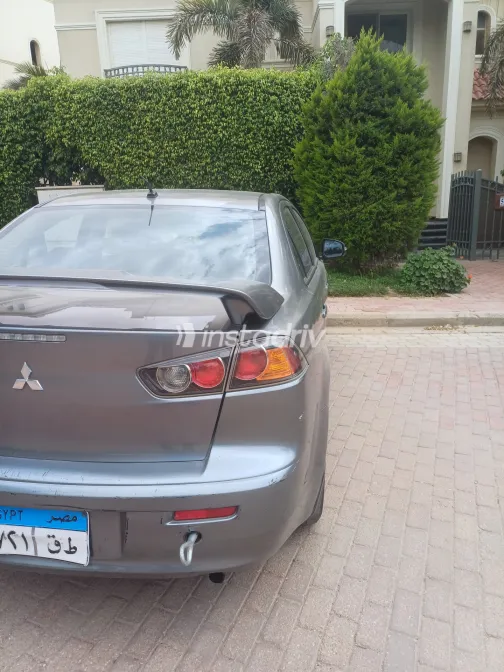 ميتسوبيشي لانسر 2015 أبيض مستعملة للبيع - 6