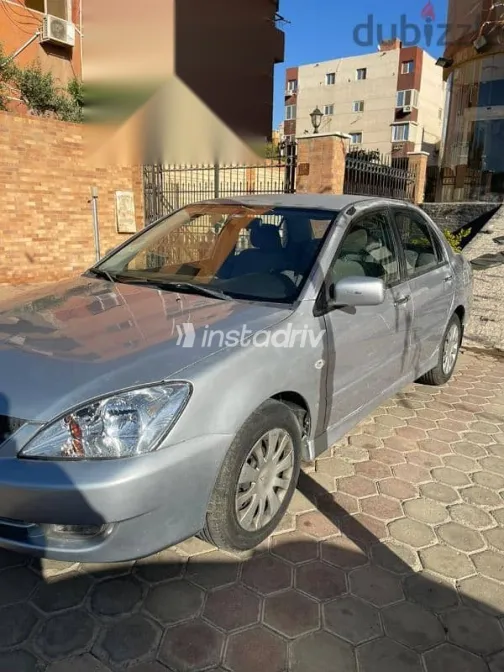 ميتسوبيشي لانسر 2007 فضي مستعملة للبيع - 4