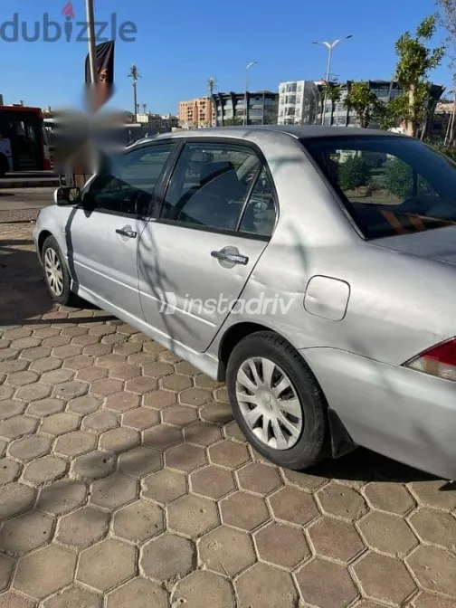 ميتسوبيشي لانسر 2007 فضي مستعملة للبيع - 5